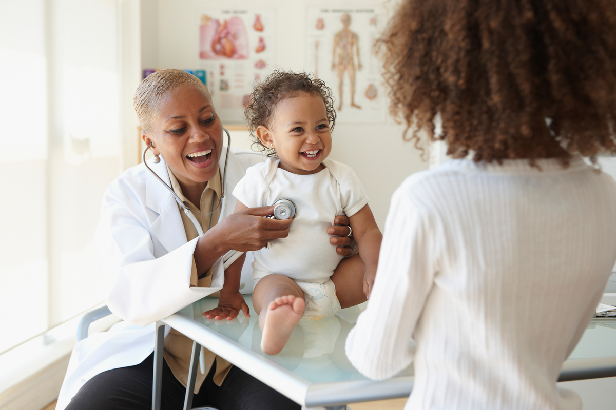 Provider checking in on a pediatric patient while mother is in office. She is checking the child's heartbeat